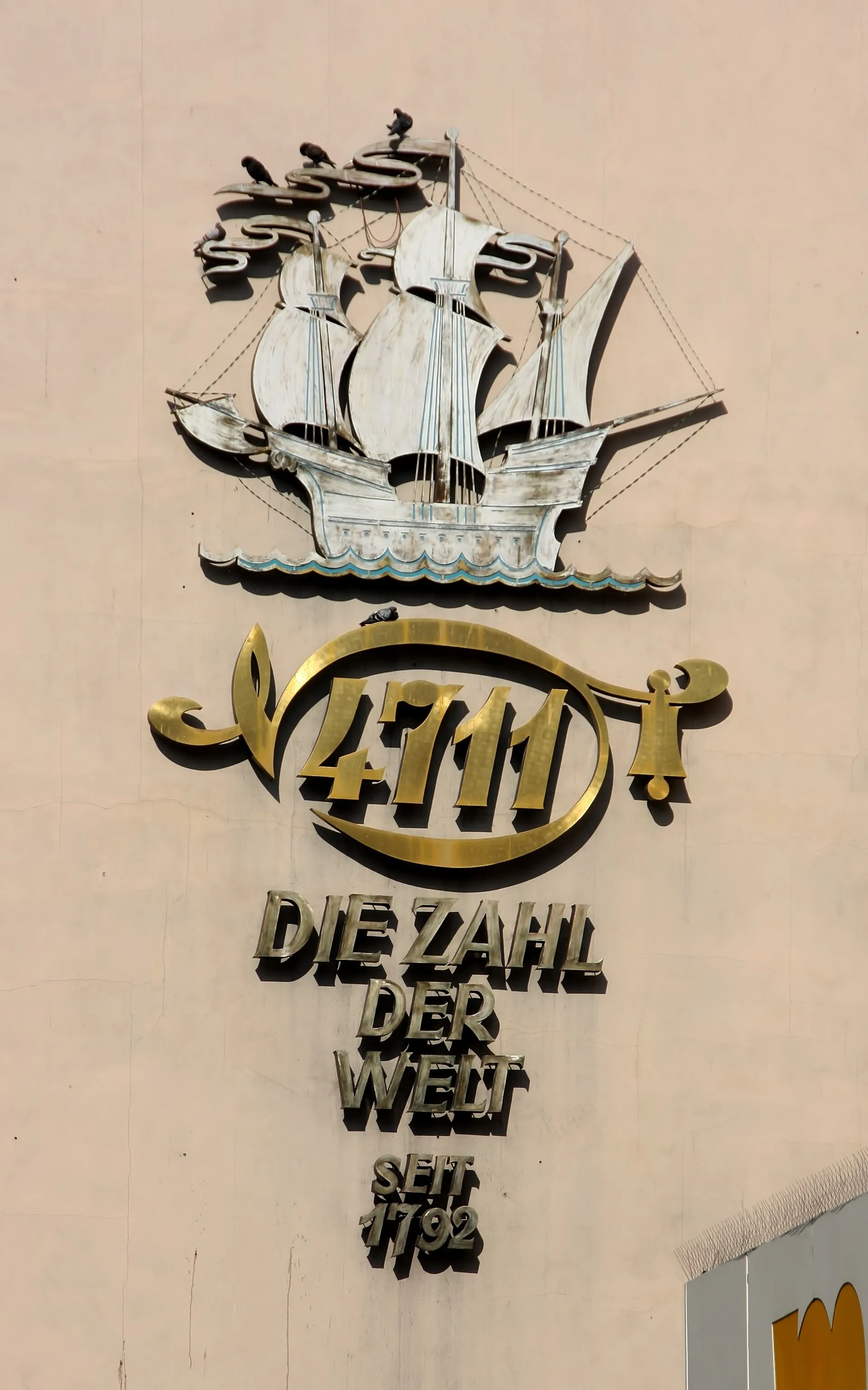 Adversiting for 4711 at a house wall, Wallrafplatz, Cologne, Germany