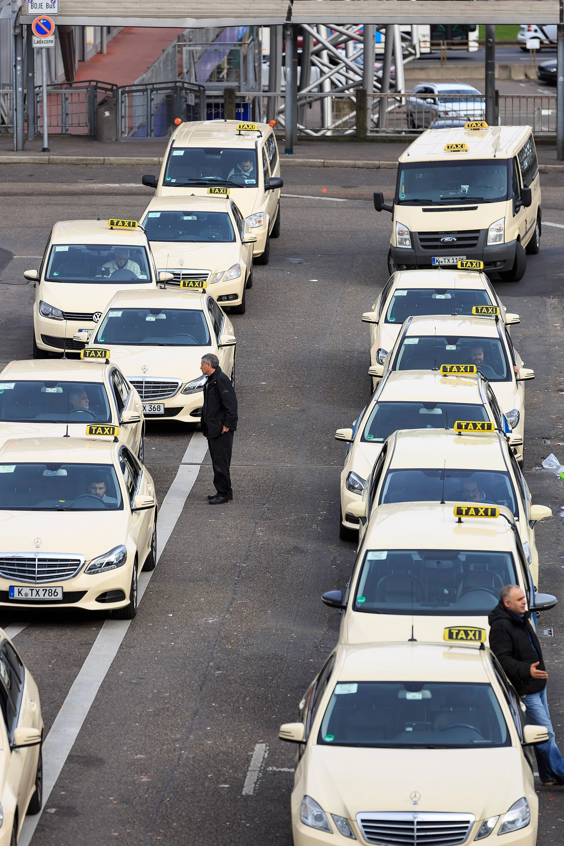 Cologne, Germany: Taxi drivers waiting in front of the central station for customers