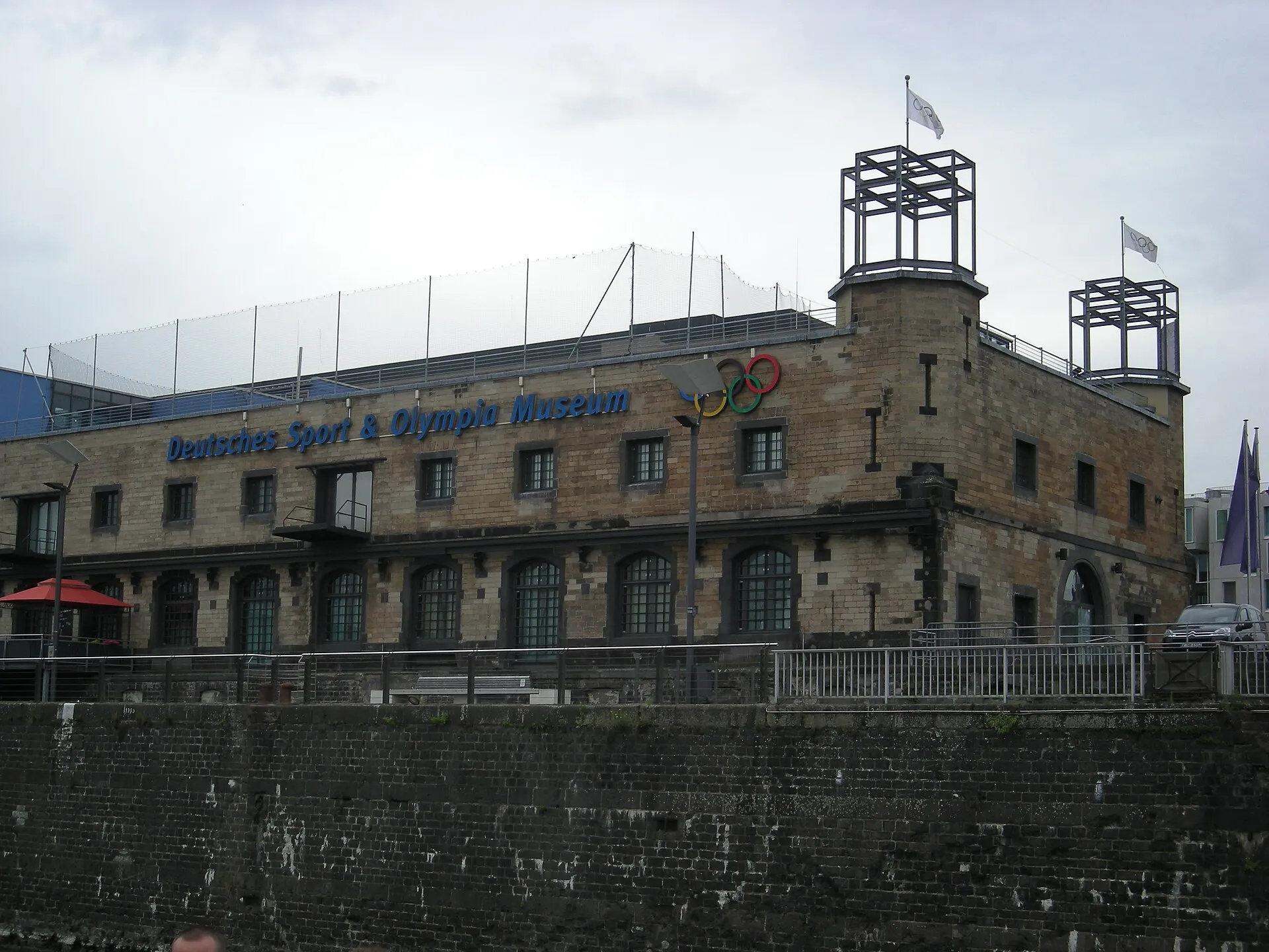The Deutsches Sport & Olympia Museum as seen from the Rhine in Köln , Nordrhein-Westfalen ( Germany ).