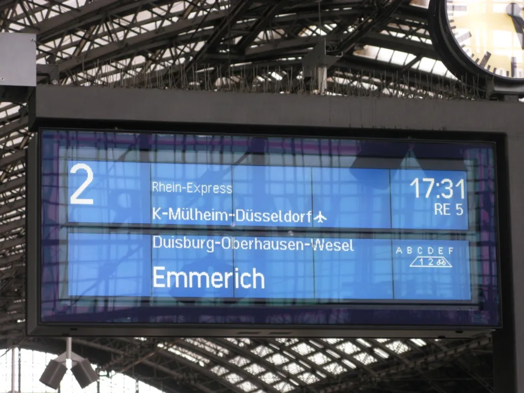 Platform departure information sign at Cologne central station (Hbf), Track 2, indicating departure of RE (Regional Express) line 5 "Rhein-Express" to Emmerich.