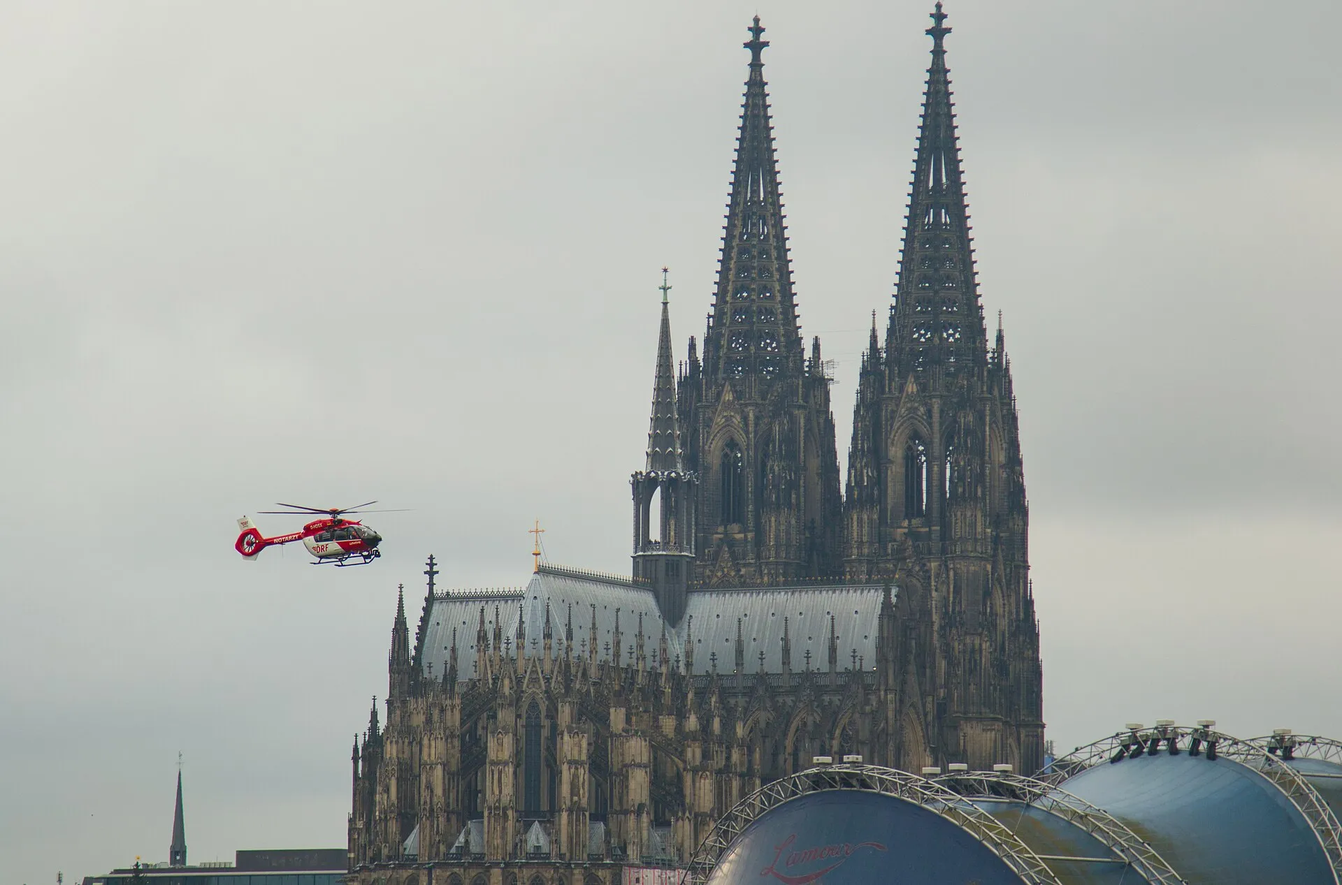 Rescue helicopter, operated by DRF, during a training in front of the Cologne cathedral.
