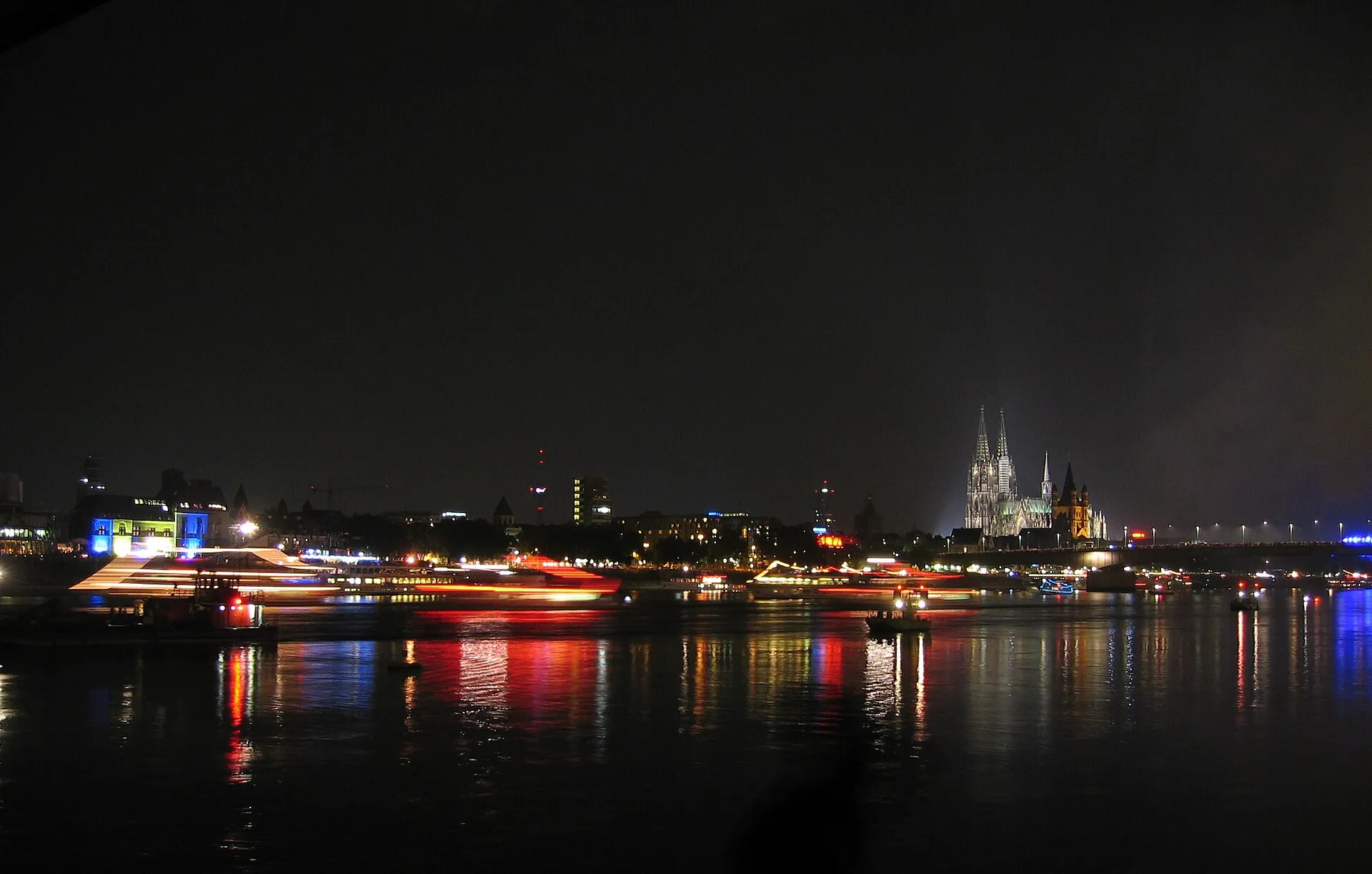 Cologne Cathedral and Old Town with lighted ships