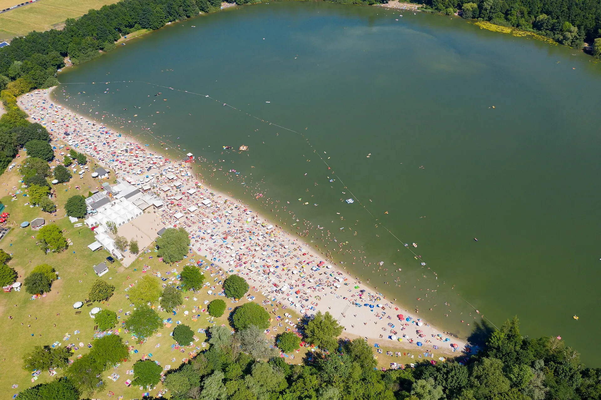 Aerial view of the lake and sand beach at Otto-Maigler-See in Hürth, Germany